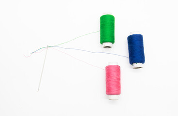 Colorful yarn on spool, yarn on tube, cotton, wool, linen thread, polyester selective focus on red spool