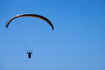 Hang glider in the blue sky