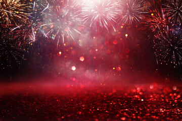 abstract black, red and gold glitter background with fireworks. christmas eve, 4th of july holiday...