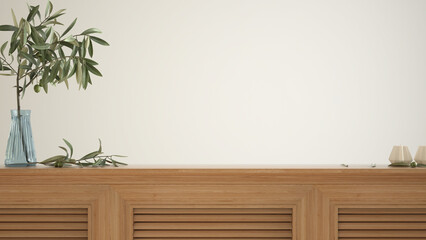 Wooden table top, cabinet, panel or shelf with shutters close up. Olive branch in glass vase, leaves and candles. White wall background with copy space, interior design