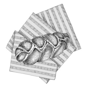 Fresh homemade braided egg bread on towel