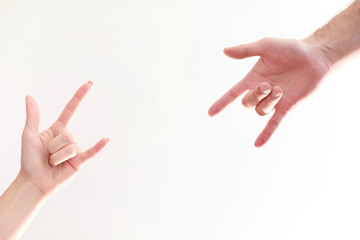 rock sign male and female hand on isolated background