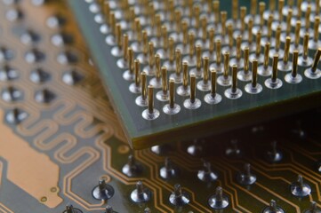 microprocessor on the background of the microcircuit of the motherboard