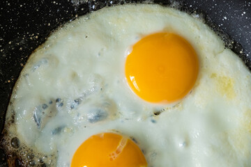 Fried eggs from two eggs. View from above. Fried eggs, delicious food.
