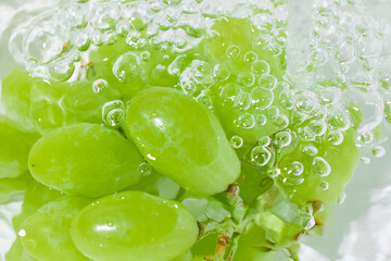 fresh grapes on water