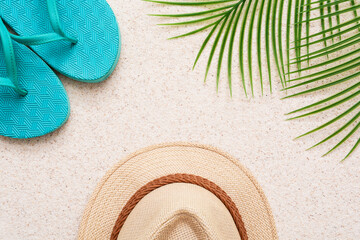 Summer minimalist mockup / template on a sand background with straw hat, flipflop, palm tree and...