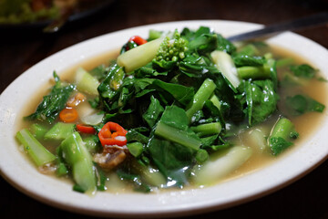 Stir fry Choy Sum. Choy Sum is a leafy vegetable commonly used in Chinese cuisine. Soft focus image.