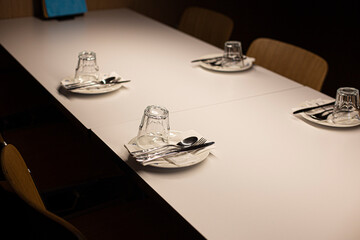 table setting, restaurant interior. white empty plate.