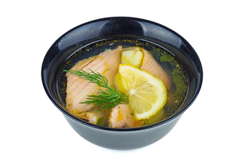 Black ceramic bowl with salmon soup isolated on white background