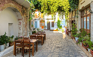Fototapeta na wymiar Empty small taverna in village Panormos at Crete island, Greece