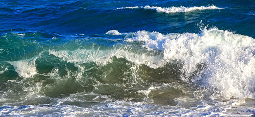 Waving sea on the coastline. Splash water