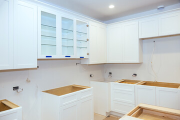 Fototapeta na wymiar Remodeling kitchen cabinets and assembling new kitchen furniture