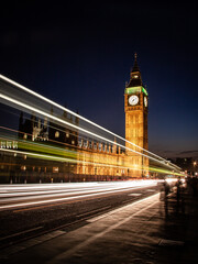 Big Ben at night, London. Long exposure traffic streaming by the famous Big Ben and Houses of...