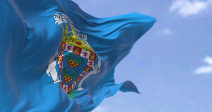 Rear view of Mellla city flag waving in the wind on a clear day