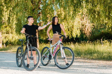 Fototapeta na wymiar Couple on bicycles in the park