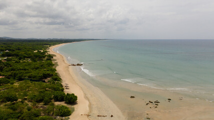 Fototapeta na wymiar Aerial view of Tropical sandy beach and blue sea. Sri Lanka. Summer and travel vacation concept.