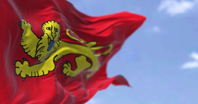 Rear view of the Aquitaine flag waving in the wind on a clear day