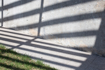 The power sockets on an old cement wall with light