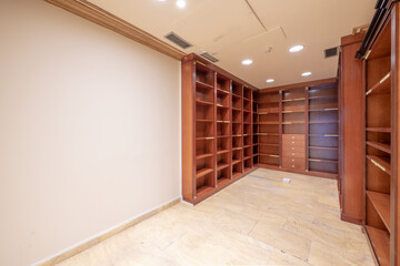 File room with shelves with many compartments and wooden drawers in a professional office
