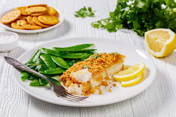 Baked Cod with Crackers toppings and snow peas