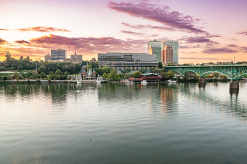 The city skyline of Knoxville along the Tennessee River at sunset - 512819490