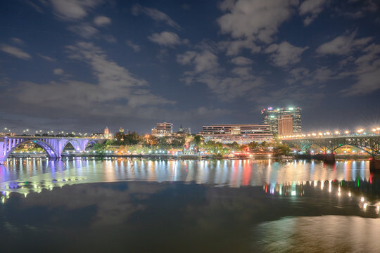 The City Skyline Of Knoxville Along The Tennessee River At Night