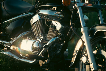 Detail of vintage motorcycle in sunset