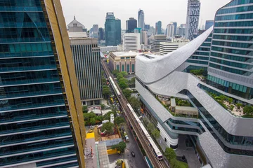 Fotobehang Pathum Wan,Bangkok,Thailand on March16,2019:BTS Skytrain railways above Phloen Chit Road,with Krungsri Phloenchit Tower on the left and Central Embassy on the right.  © mickey_41
