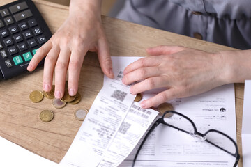 Coins, receipts, papers, glasses, a calculator