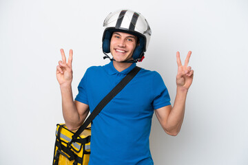 Young caucasian man with thermal backpack isolated on white background showing victory sign with both hands