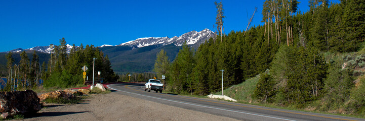 Truck passes on Dillon Dam Road in White River National Forest in Colorado