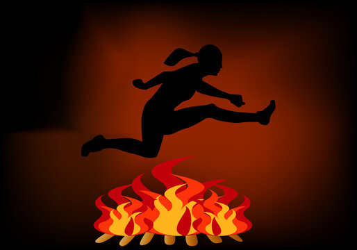Hoguera de San Juan. Persona, chica saltando la hoguera de la Noche de San Juan