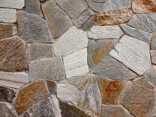 Colorful textured stone wall background. Mosaic floor.