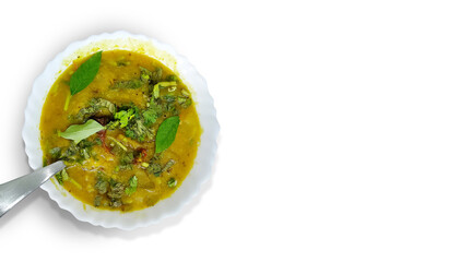 Traditional south indian snack dal sambhar soup with curry leaves