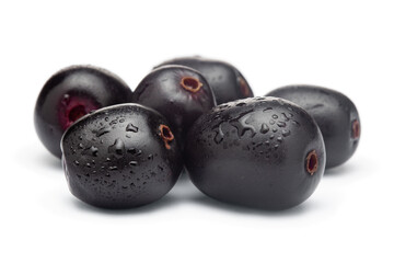 Close-Up of collection of Indian Ayurvedic medicinal fresh fruit jamun (Syzygium Cumini) or black plum isolated in white background.