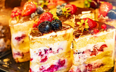 Piece of creamy strawberry cake in restaraunt close up