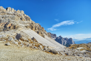 Mountain path Tre Cime National Park on autumn day, Dolomites Mountains, Italy