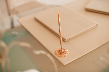 Elegant wax seal and writing pen on a vintage envelope, symbolizing the beauty of handwritten letters and personal communication.