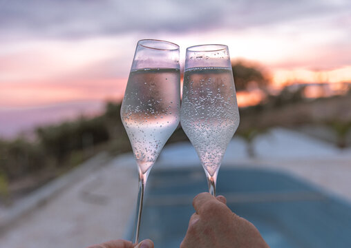 misted glassesagainst the background of the sea and the pool