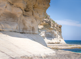 Close up of limestone cliffs and blue sea