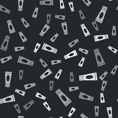 Grey Cream or lotion cosmetic tube icon isolated seamless pattern on black background. Body care products for men. Vector Illustration