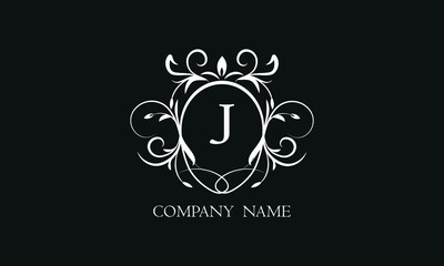 Elegant floral monogram with decorative elements and the letter J. Template for invitations, labels, business. Wedding monograms. Exquisite calligraphic ornament.