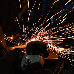 worker steel grinding and cutting