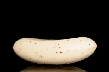 One fragrant bar of soap, close-up, isolated on a black background.