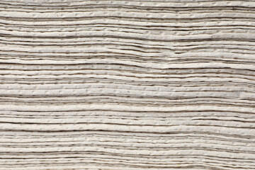 Texture staked of paper towels as background, closeup view