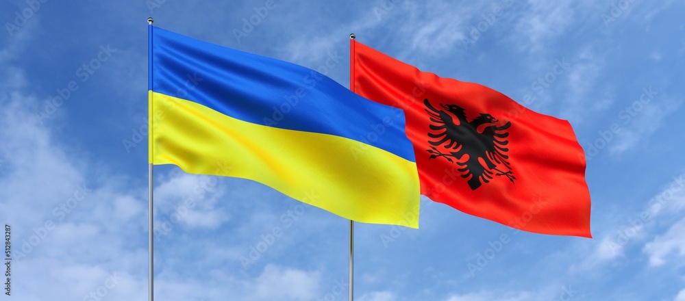 Wall mural Flags of Ukraine and Albania on flagpoles in center. Flags on sky background. Place for text. Ukrainian. Tirana. 3d illustration.