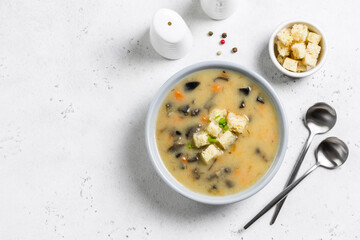 Mushroom soup with croutons. Top view, copy space.