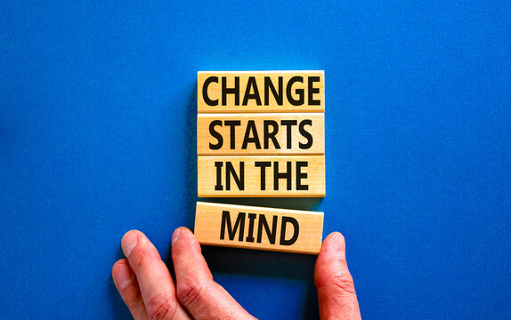 Change starts in the mind symbol. Concept words Change starts in the mind on wooden blocks on a beautiful blue table blue background. Business, motivational and change starts in the mind concept.