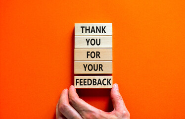 Thank you for feedback symbol. Concept words Thank you for your feedback on wooden blocks on a...