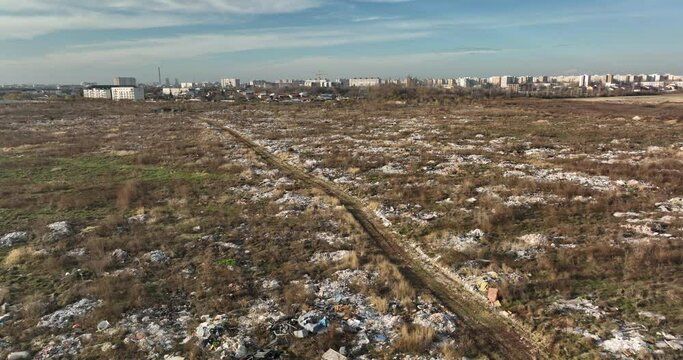 Garbage dump. City of Bucharest on hte background. Enviroment pollution concerns